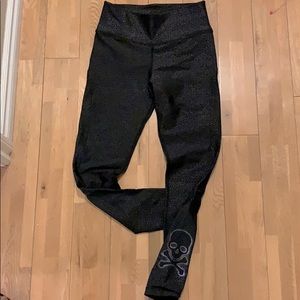 Soulcycle black speckled leggings.